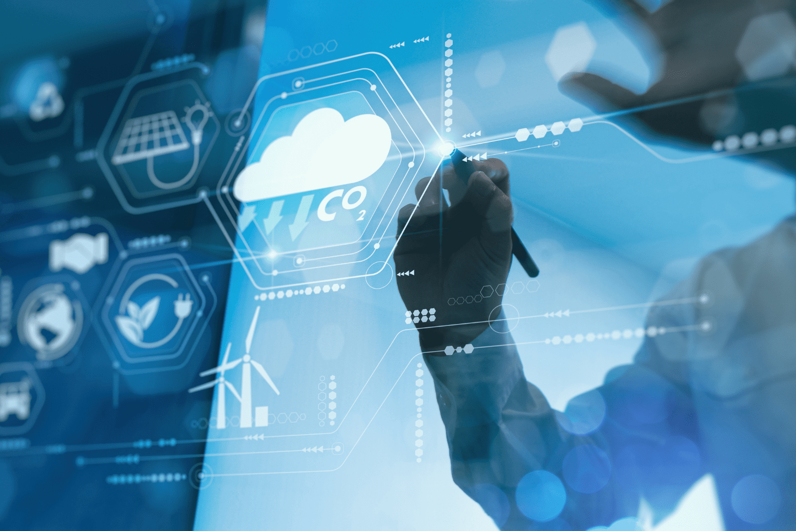 man teaching woman while pointing on gray laptop