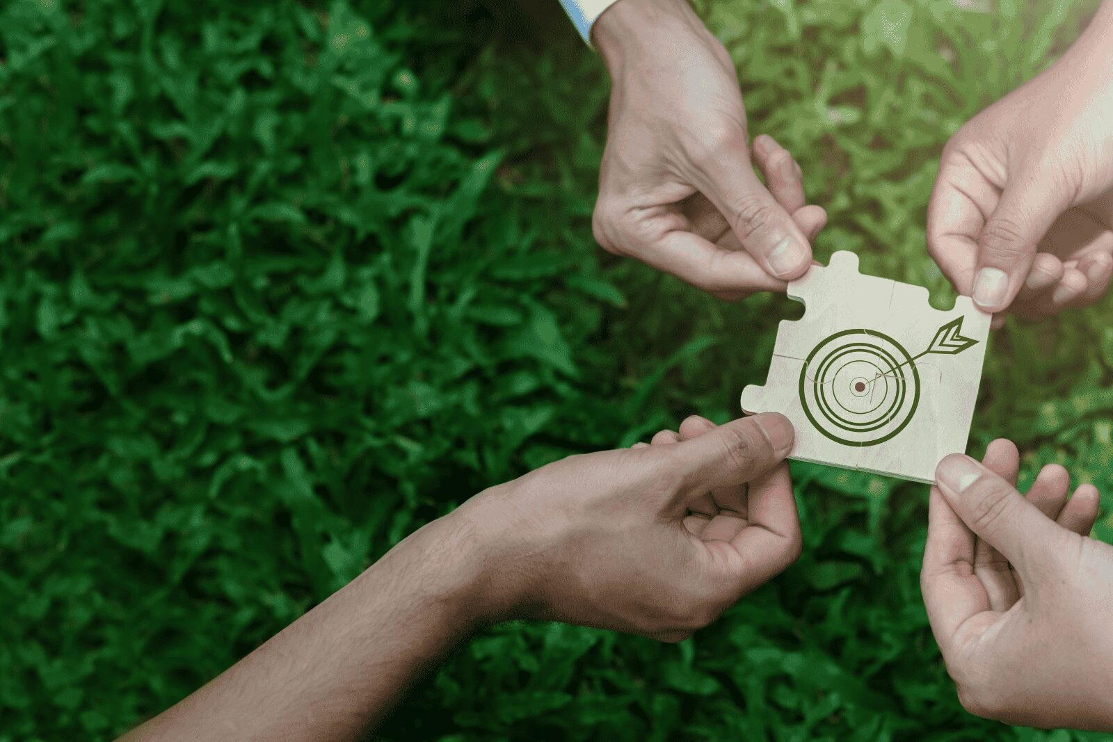 people sitting at the table looking to another person standing in front of them